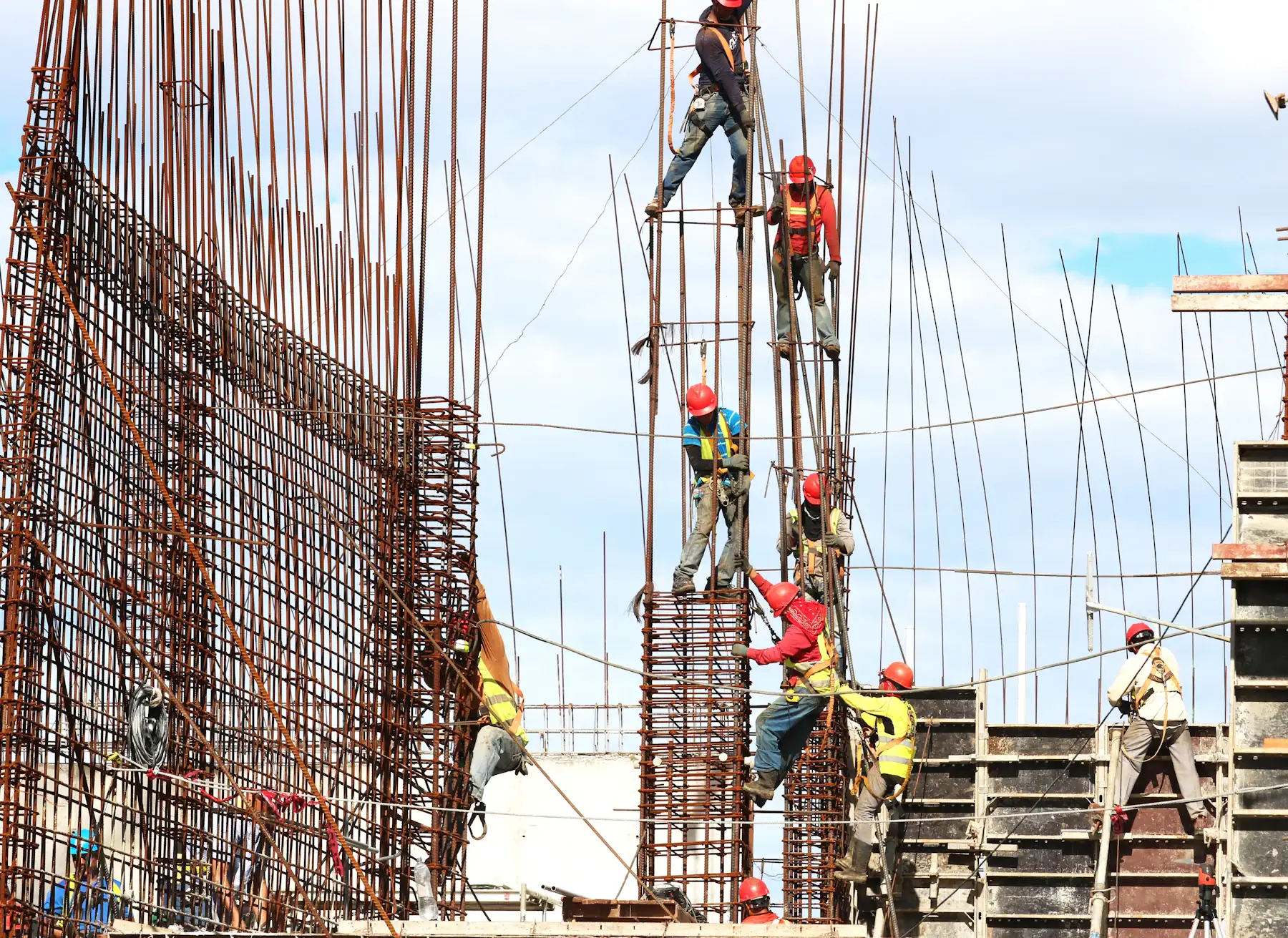 Crew tying rebar cages for concrete columns